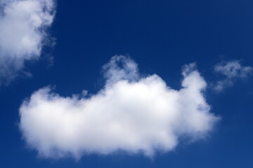 white clouds are floating across the sky