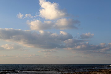 white clouds are floating across the sky