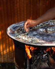 Memela or mamelita is a mexican oval tortilla, handmade with corn dough. They are thick and covered...