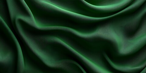 Obraz premium Luxurious dark green fabric with elegant folds and soft texture.