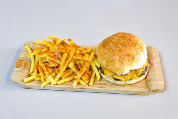 Big tasty burger with beef cutlet on a plate. Hamburger, cheeseburger with mushroom. Hamburger, Mexica, mushroom double burger.  Crispy chicken burger. With french fries, patates kizartmasi.