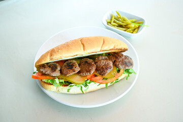 Meatball between bread (Turkish name : ekmek arasi kofte ) Izgara kofte. Manisa, Akcaabat, Akhisar  kofte. Delicious meat grilled meatballs.