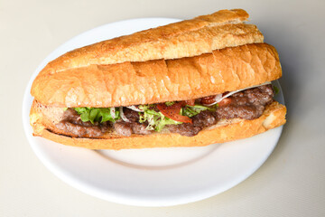 Meatball between bread (Turkish name : ekmek arasi kofte ) Izgara kofte. Manisa, Akcaabat, Akhisar  kofte. Delicious meat grilled meatballs.
