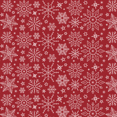 Snowflakes seamless pattern on red background. Subtle pattern with white snowflakes on red background. Winter holidays theme, Christmas and New Year