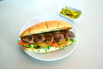 Meatball between bread (Turkish name : ekmek arasi kofte ) Izgara kofte. Manisa, Akcaabat, Akhisar  kofte. Delicious meat grilled meatballs.