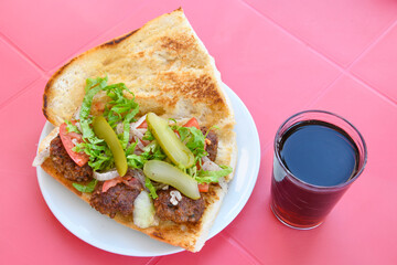 Meatball between bread (Turkish name : ekmek arasi kofte ) Izgara kofte. Manisa, Akcaabat, Akhisar  kofte. Delicious meat grilled meatballs.