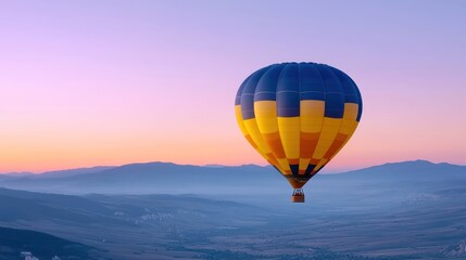 Obraz premium A colorful hot air balloon soaring over a serene landscape at dusk.