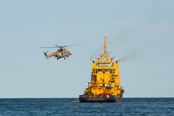 training of rescue ship and rescue helicopter at sea