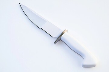 Obraz premium A single knife with a black handle placed on a clean white surface