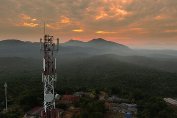 Transmission tower with sunrise sky background