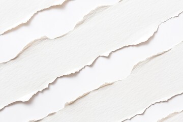A close-up shot of torn paper on a white surface, often used in creative projects and designs