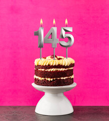 Red velvet cake - Birthday number 145 on a pink background.