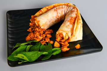 Meat, chicken shawarma kebab with yogurt and fried butter sauce .Tantuni Special. Yogurtlu Mersin...