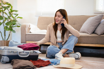 Beautiful smiling woman with suitcase,talking on  smartphone, holds travel tickets and passport. Tourism and travelling concept