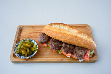 Meatball between bread (Turkish name : ekmek arasi kofte ) Izgara kofte. Manisa, Akcaabat, Akhisar  kofte. Delicious meat grilled meatballs.