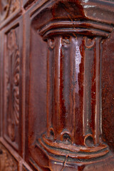 Terra cotta column texture, on a romanian heating stove, soft focus close up,