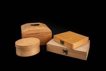 Wooden boxes with closed lid scattered and isolated on black  background, abstract gift concept