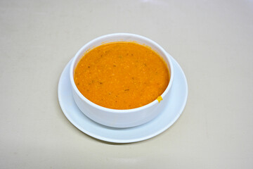 Turkish Ezo Gelin soup, Traditional Turkish Soup. Geleneksel Ezogelin corbasi. Ezogelin Soup Served with a slice of lemon. Top view