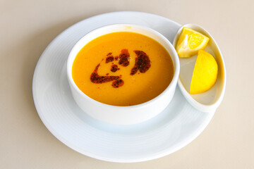 Turkish Ezo Gelin soup, Traditional Turkish Soup. Geleneksel Ezogelin corbasi. Ezogelin Soup Served with a slice of lemon. Top view