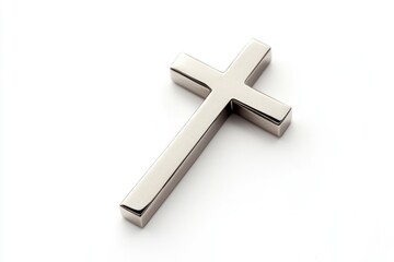 Obraz premium A silver cross stands out on a white surface, perfect for use in spiritual or faith-based contexts