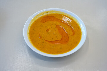 Turkish Ezo Gelin soup, Traditional Turkish Soup. Geleneksel Ezogelin corbasi. Ezogelin Soup Served with a slice of lemon. Top view