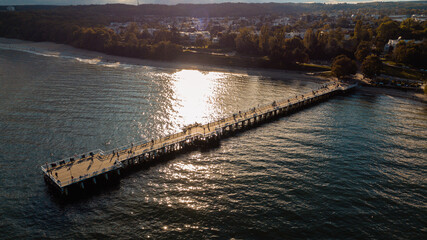 a pier on the sea coast on an autumn evening