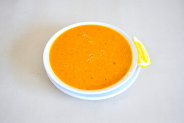 Turkish Ezo Gelin soup, Traditional Turkish Soup. Geleneksel Ezogelin corbasi. Ezogelin Soup Served with a slice of lemon. Top view