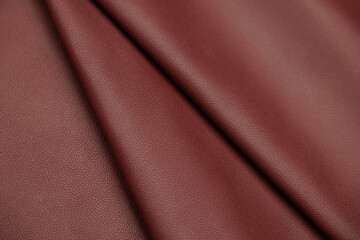 Leather texture: Elegant folds and shading A representation of high quality leather with visible wrinkles and shading that highlight the softness and structure of the material.