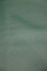Leather texture: Elegant folds and shading A representation of high quality leather with visible...