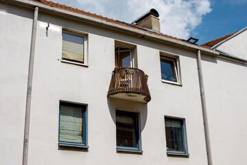 Vilnius architecture: facade of an apartment building with a small balcony, Lithuania