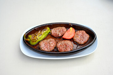 Meatball between bread (Turkish name : ekmek arasi kofte ) Izgara kofte. Manisa, Akcaabat, Akhisar  kofte. Delicious meat grilled meatballs.