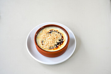 Baked rice pudding turkish milky dessert sutlac, keskul  (Turkish name; firin sutlac). Findikli Hamsikoy Sutlac