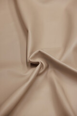 Leather texture: Elegant folds and shading A representation of high quality leather with visible wrinkles and shading that highlight the softness and structure of the material.