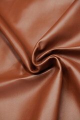 Leather texture: Elegant folds and shading A representation of high quality leather with visible...