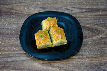 Turkish Dessert Sobiyet, havuc dilimi, midye baklava, mussels baklava and classic baklava with Pistachio . Cikolatali cevizli, fistikli soguk Baklava, top view.