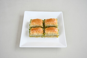 Turkish Dessert Sobiyet, havuc dilimi, midye baklava, mussels baklava and classic baklava with Pistachio . Cikolatali cevizli, fistikli soguk Baklava, top view.