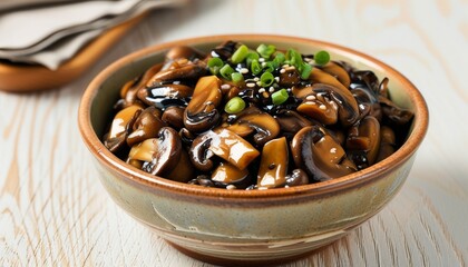 Fototapeta premium Delicious Fried Mushrooms Served in a Rustic Bowl with Chopped Green Onions and Sauce