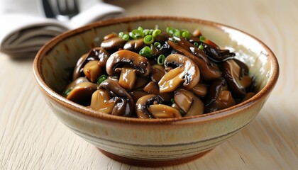 Fototapeta premium Delicious stir-fried pad mushrooms with green onion in a rustic bowl, perfect for culinary delights