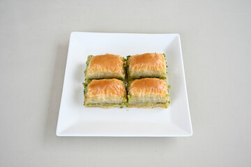 Turkish Dessert Sobiyet, havuc dilimi, midye baklava, mussels baklava and classic baklava with Pistachio . Cikolatali cevizli, fistikli soguk Baklava, top view.