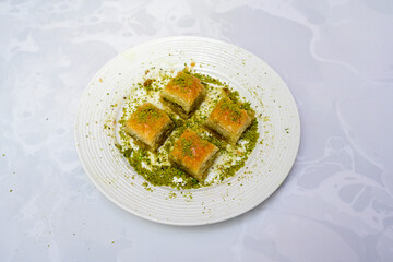 Turkish Dessert Sobiyet, havuc dilimi, midye baklava, mussels baklava and classic baklava with Pistachio . Cikolatali cevizli, fistikli soguk Baklava, top view.