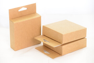 two brown cardboard boxes on a white background