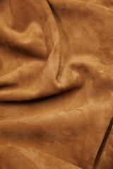 Leather texture: Elegant folds and shading A representation of high quality leather with visible wrinkles and shading that highlight the softness and structure of the material.