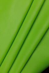 Leather texture: Elegant folds and shading A representation of high quality leather with visible wrinkles and shading that highlight the softness and structure of the material.