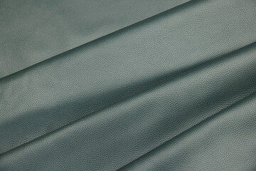 Leather texture: Elegant folds and shading A representation of high quality leather with visible wrinkles and shading that highlight the softness and structure of the material.