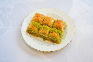 Turkish Dessert Sobiyet, havuc dilimi, midye baklava, mussels baklava and classic baklava with Pistachio . Cikolatali cevizli, fistikli soguk Baklava, top view.