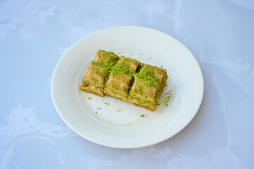 Turkish Dessert Sobiyet, havuc dilimi, midye baklava, mussels baklava and classic baklava with Pistachio . Cikolatali cevizli, fistikli soguk Baklava, top view.