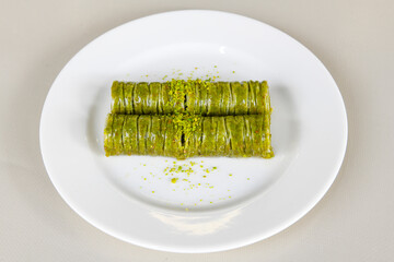 Turkish Dessert Sobiyet, havuc dilimi, midye baklava, mussels baklava and classic baklava with Pistachio . Cikolatali cevizli, fistikli soguk Baklava, top view.