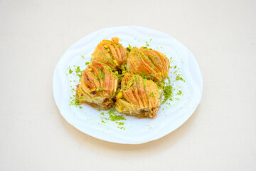 Turkish Dessert Sobiyet, havuc dilimi, midye baklava, mussels baklava and classic baklava with Pistachio . Cikolatali cevizli, fistikli soguk Baklava, top view.