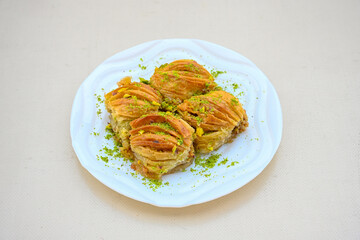 Turkish Dessert Sobiyet, havuc dilimi, midye baklava, mussels baklava and classic baklava with Pistachio . Cikolatali cevizli, fistikli soguk Baklava, top view.