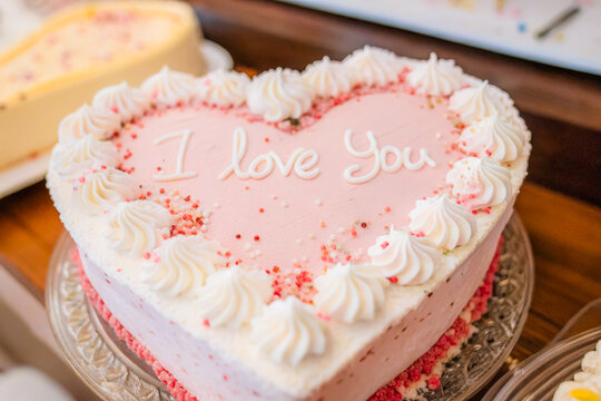 a heart shaped cake with a message on it